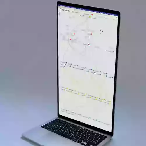 Image of an extended laptop displaying the EURO—VISION website.