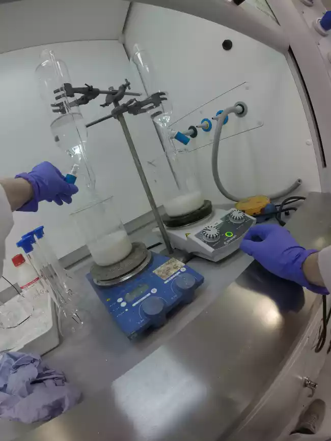 Image of the making of the phosphorescent pigment, showing lab equipment from Loughborough University's chemistry lab.